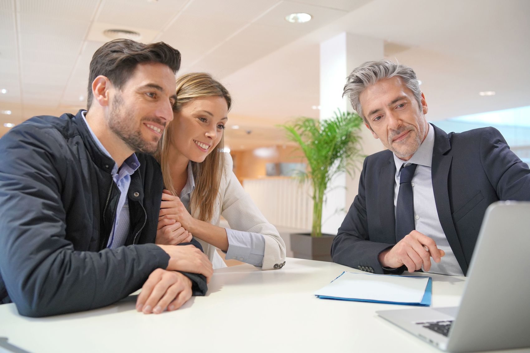 A couple meeting with their financial advisor