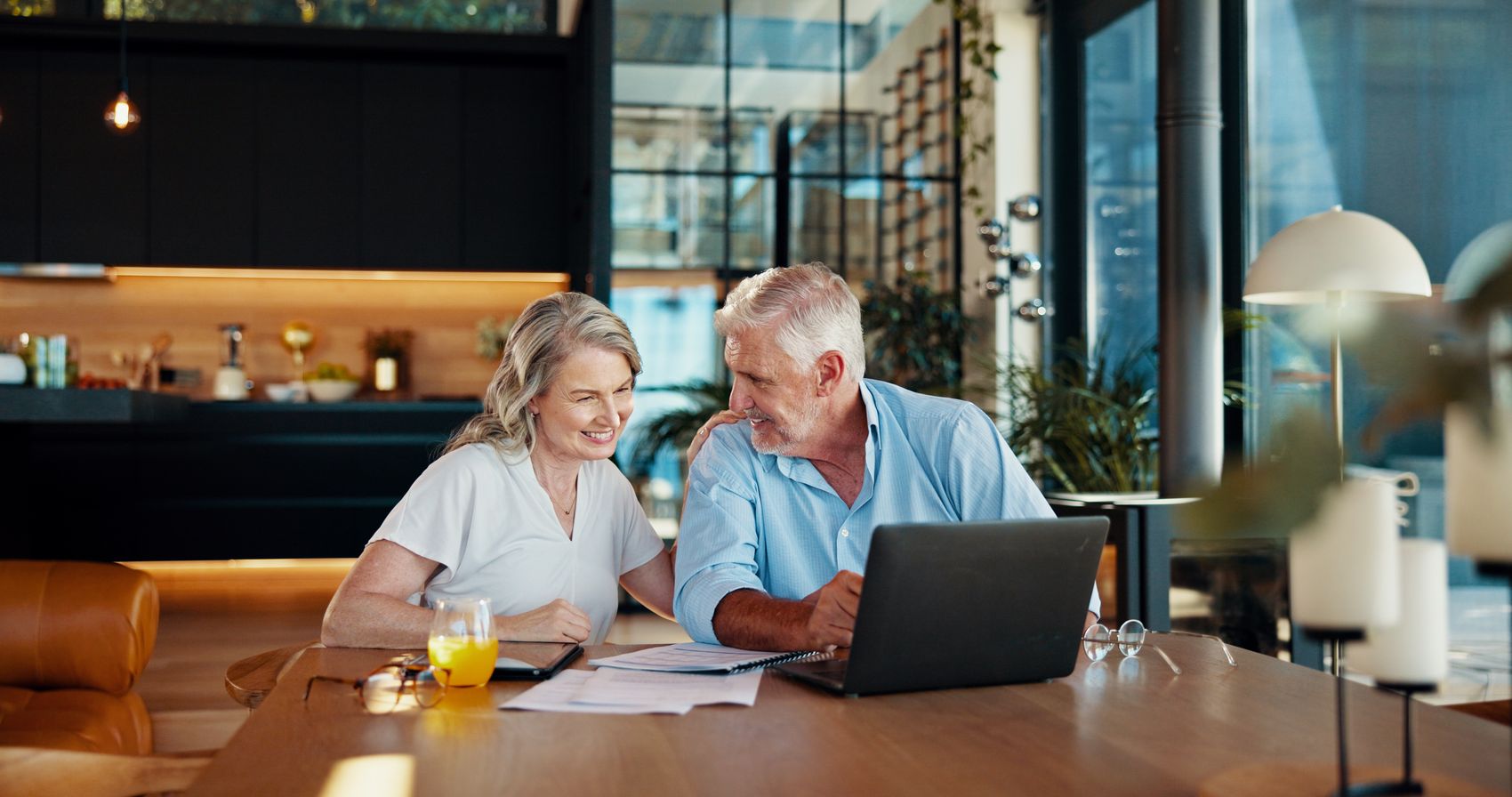 A mature couple reviewing their finances at home