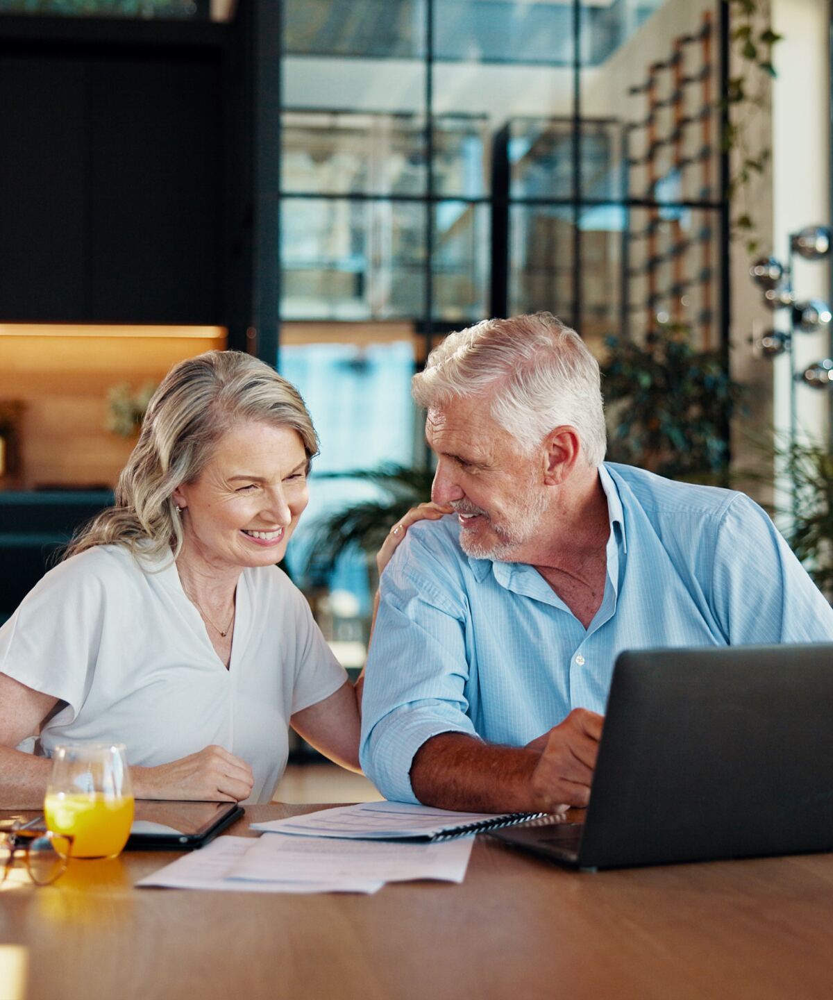 A mature couple reviewing their retirement plan at home